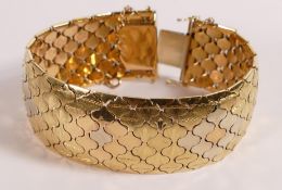 18ct three coloured gold ornate bracelet,floral decorated, L19 x w.2.5cm, 89.6g.