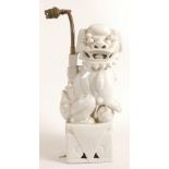 Chinese white porcelain Lion Dog table lamp (later lamp conversion), height 34cm.