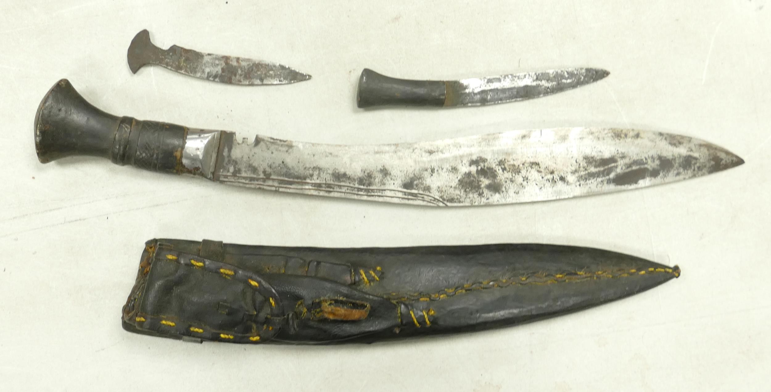 20th century Indian subcontinent Kukri knife, with two smaller blades, in leather sheath. 30.8cm