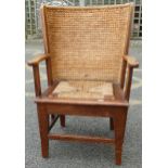 Oak framed Orkney chair with woven and stitched curved rush back, open armrests and woven seagrass