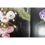 Two painted Oriental lacquered wood panels, both decorated with flowers, 61 x 27cm. (2)