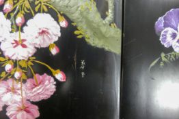Two painted Oriental lacquered wood panels, both decorated with flowers, 61 x 27cm. (2)