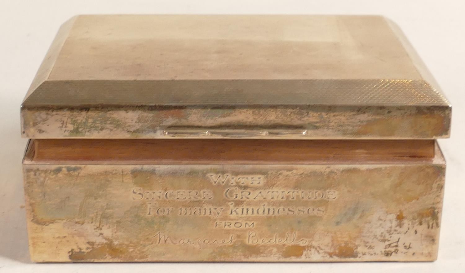 Hallmarked silver cigarette box, with engraved dedication to front. Gross weight 424.3g including