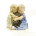 Royal Copenhagen model of a boy & girl cuddling puppy 707, h.16cm.