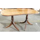 19th century mahogany D-end dining table on double tripod supports & fitted with brass castors (no