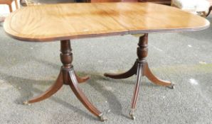 19th century mahogany D-end dining table on double tripod supports & fitted with brass castors (no