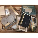 A collection of picture frames, various sizes