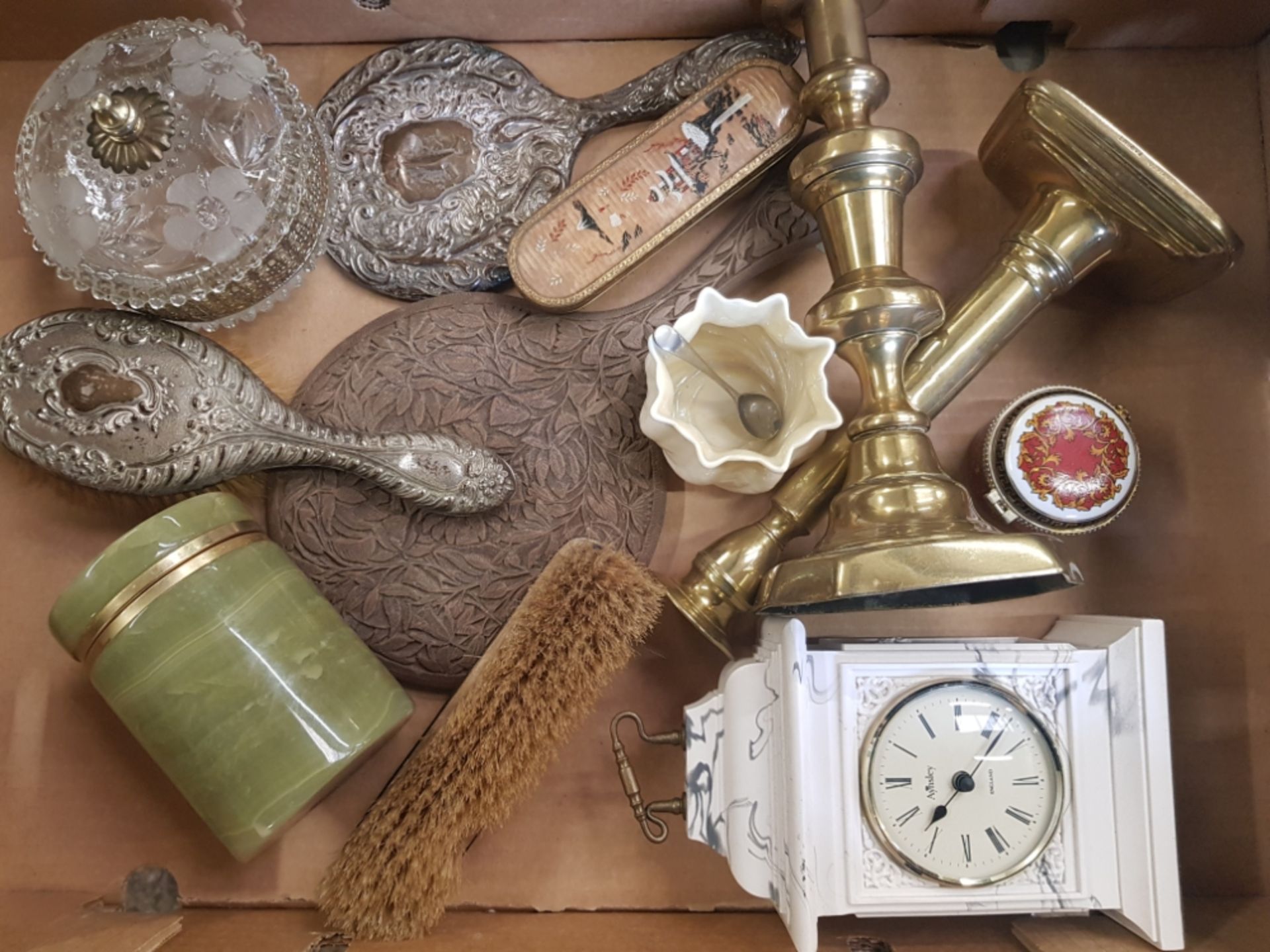 A mixed collection of items to include silver backed part dressing table set, onyx and brass