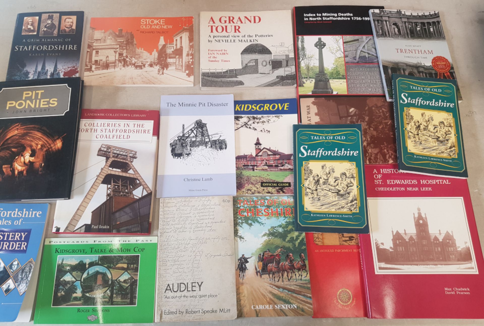 A collection of books with a local interest, together with 2 vintage small suitcases.