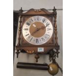 A vintage old wall clock, with weights and pendulum, 39cm in height approx.