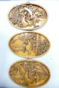 Three Carved Wood Oriental Oval Wall Panels, each diameter at widest 33cm(3)