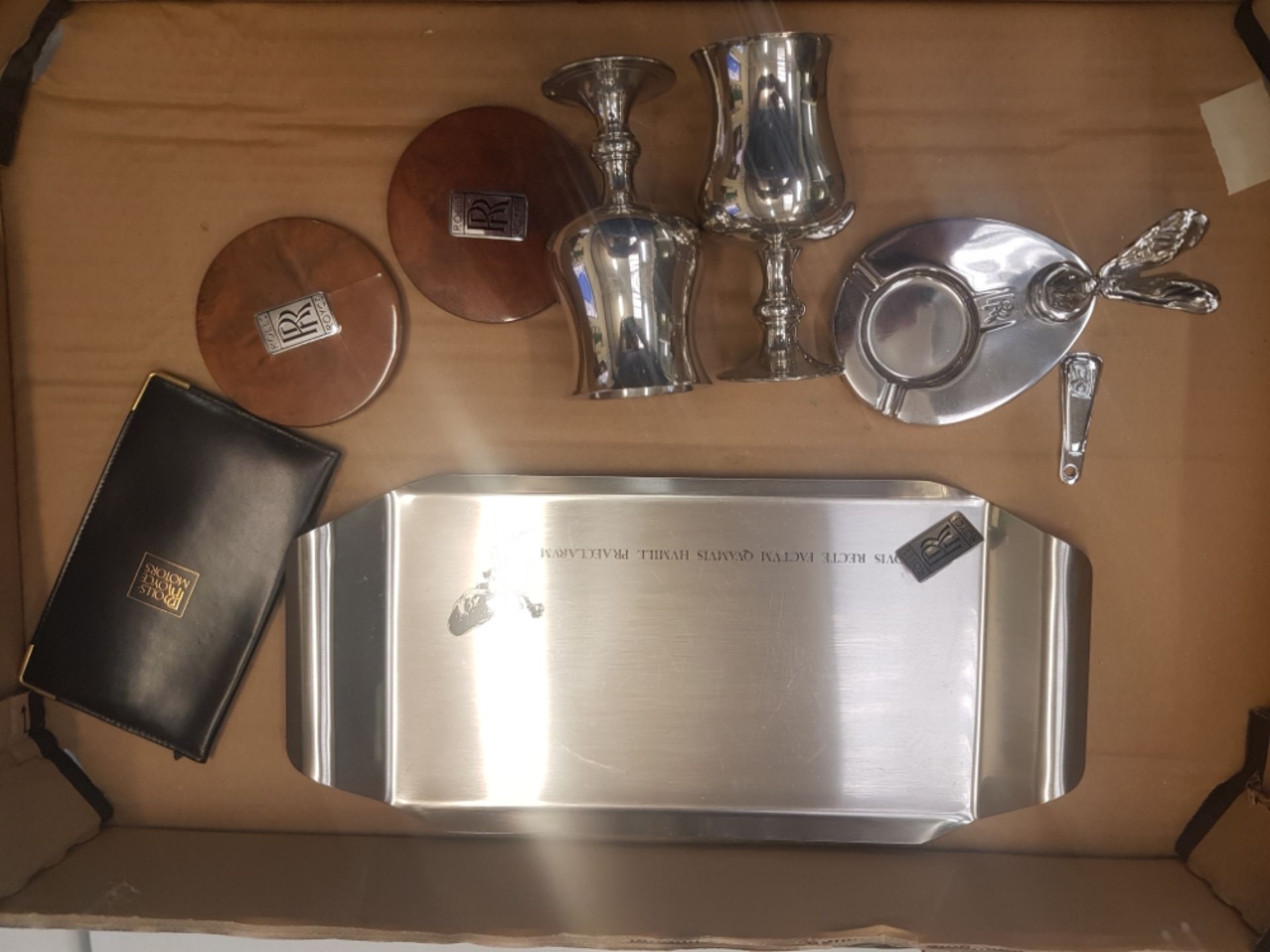 A collection of Rolls Royce related items to include silver plated goblets, ash tray, badge ,