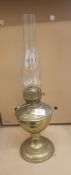 A handblown glass and base metal oil lamp, overall height 52cm.