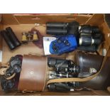 A collection of vintage binoculars , together with compact items and opera glasses