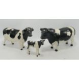 Beswick Friesian family comprising bull 1439 (damaged horn & restored), cow 1362 and calf 1249C(3)