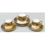De Lamerie Fine Bone China heavily gilded Black Exotic Garden patterned cup & saucer sets & small