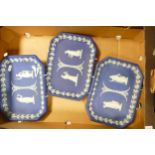 Three Wedgwood Early 20th Century Dip Blue Rectangular Wall Plaques, each 26.5cm in length