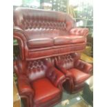 Oxblood leather Chesterfield high back 3 seater sofa and 2 matching armchairs.