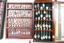 Collection of 130+ spoons contained in 4 specialist spoon collectors cabinets