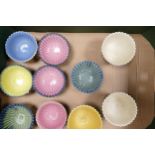 A collection of Wade Ceramic Ruffled Edged small bowls in varying colours. These were removed from