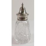 An hallmarked silver topped cut glass sugar sifter - h.16.5cm.