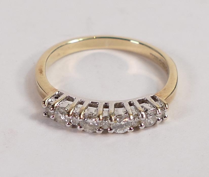 9ct hallmarked gold ladies 9 diamond set dress ring. The diamonds - 4 larger stones about 2.5mm dia,