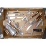 Selection of silver plated items, including carving set, water jug, sugar caster and other pieces.