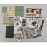 A collection of medals and items belonging to a soldier, including a group of medals including
