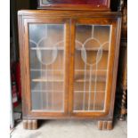 1930's Oak Bookcase with leaded glass doors, height 119cm, depth 26cm & width 93cm