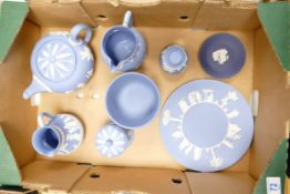 A collection of Wedgwood Jasperware to include teapot (lid button broken but present, jugs, planters