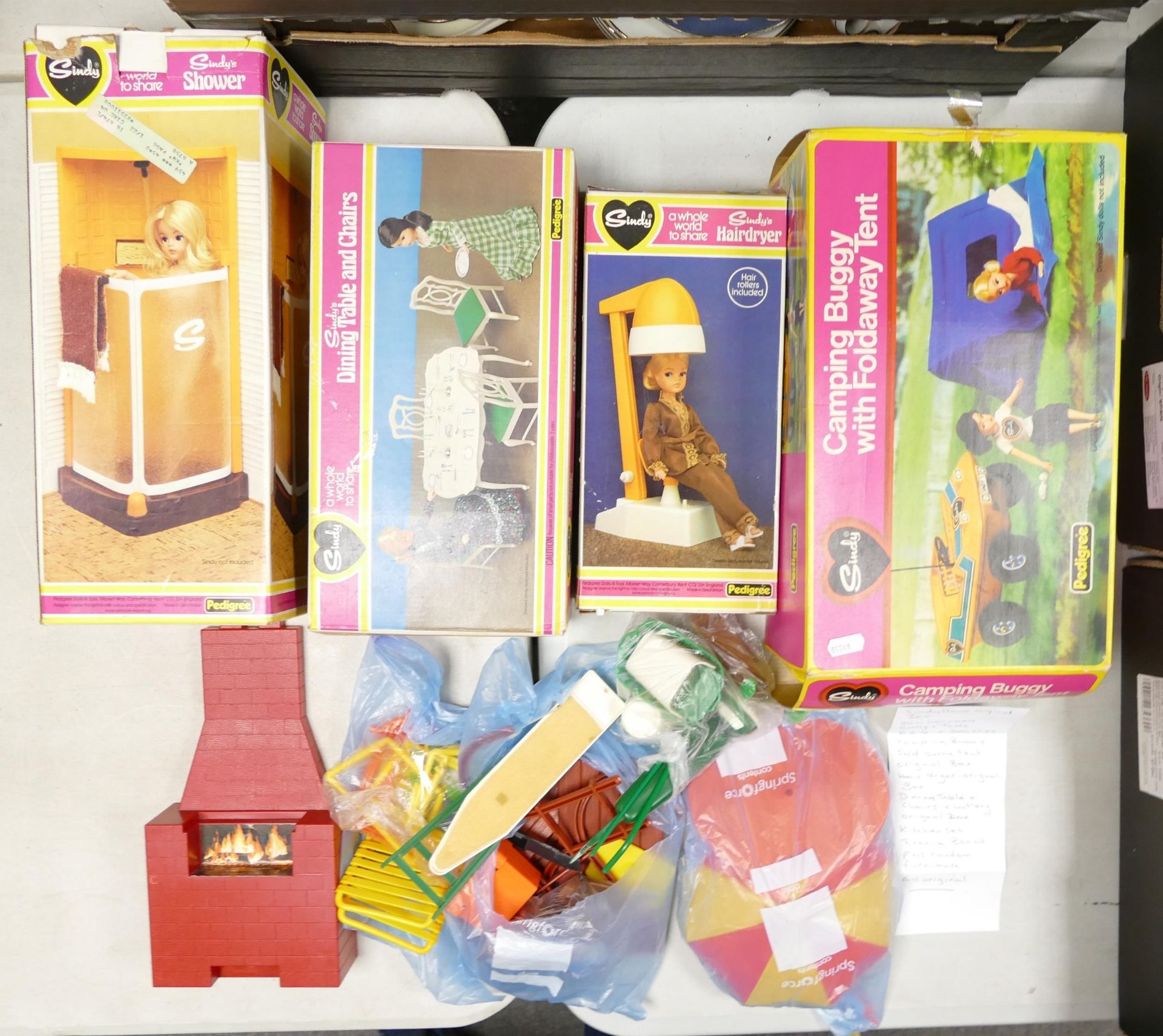 A Collection of Vintage Sindy items to include Sun Loungers, Brolly & table, Camping Buggy,