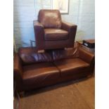 Contemporary mid brown leather 3 seater sofa and matching armchair.