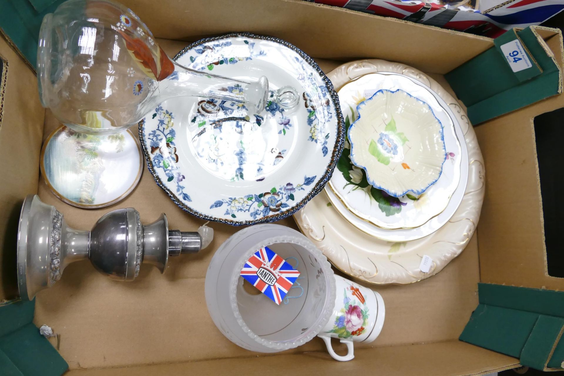A mixed collection of items to include decorative plates, hand decorated jug, pewteerr candlestick