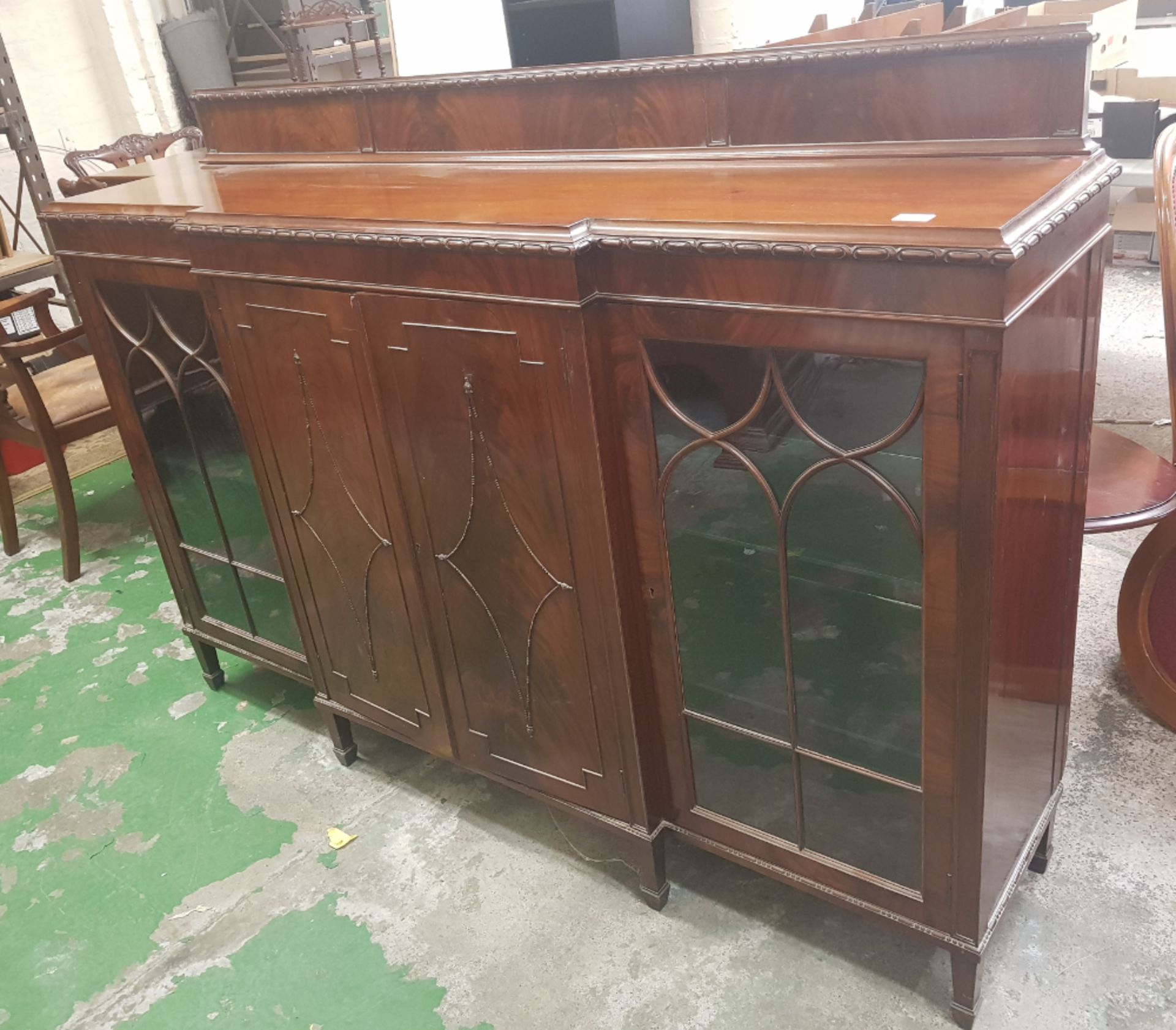 Large Mahogany break fronted sideboard standing on spade feet 182cm W