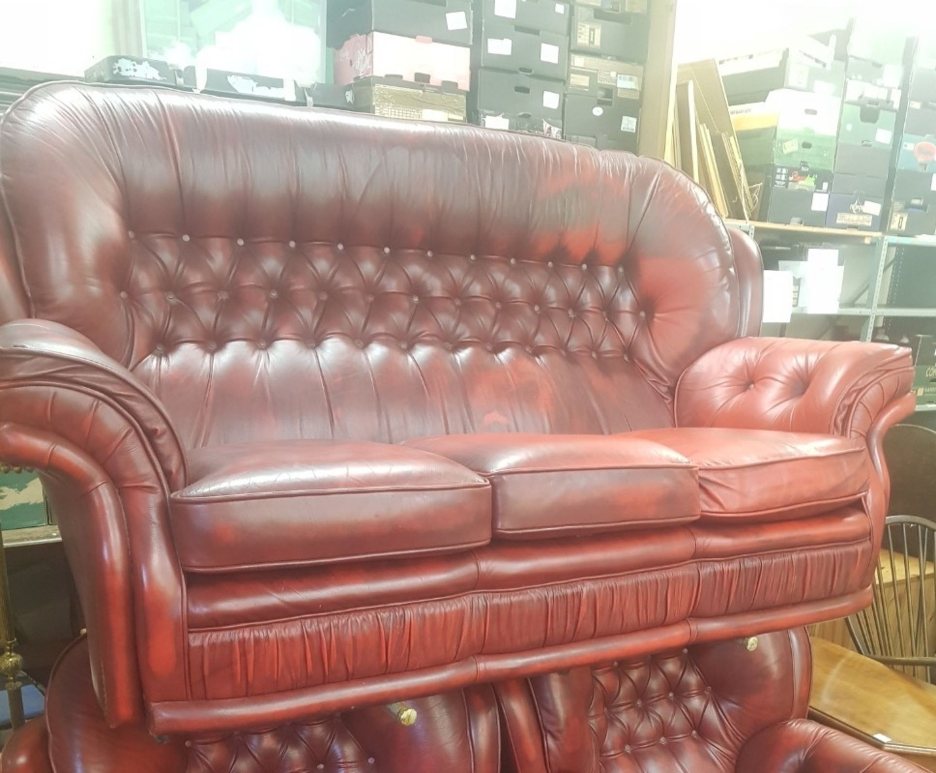 Oxblood leather Chesterfield high back 3 seater sofa.