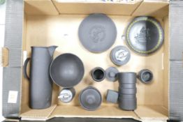 A collection of Wedgwood Black Basalt patterned items to include plates, cigarette lighters, lidless