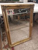 Large gilt framed bevelled edged wall mirror, overall size 89cm x 64cm.