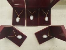 Five cased Wedgwood jasperware pendants on gold plated chains (5).