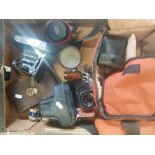 A collection of photographic equipment to include an Olympus OM10 film camera, cased Carl Zeiss Jena