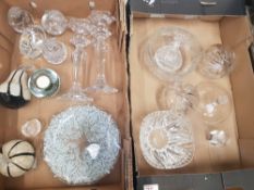 A collection of glass and crystal items to include paperweights, candlestick holders etc (2 trays).