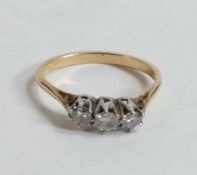 18ct three stone diamond ring, size M, 2.1g.(slightly bent)