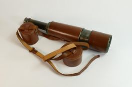 A Dollond of London brass and leather five drawer telescope with leather caps. 107cm long when