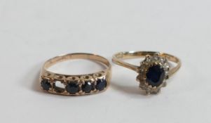 Two 9ct gold rings set with with dark blue stones,3.5g, stone missing from 5 stone ring. (2)