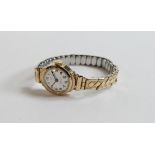 Ladies 9ct gold Limit wristwatch with gold plated expandable bracelet.