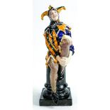 Royal Doulton Jester HN1295. Impressed date for 1927, orange & blue colour way, height 25cm.