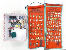 97 Golly badges, together with Robertson 8 piece Golly band 7cm high and 4 Wade figures.