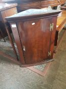 George III Bowfronted Corner cupboard with functioning lock and key. height 67cm (likely later