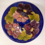 Large Moorcroft Clematis on blue charger. diameter 31cm