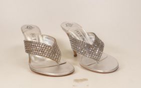 Designer Gina Silver T-strap Sandals . Made of silver leather upper adorned with silver Swarovski