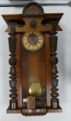 Vienna Type Wooden Cased Wall clock, wormed to lower section, total height 97cm